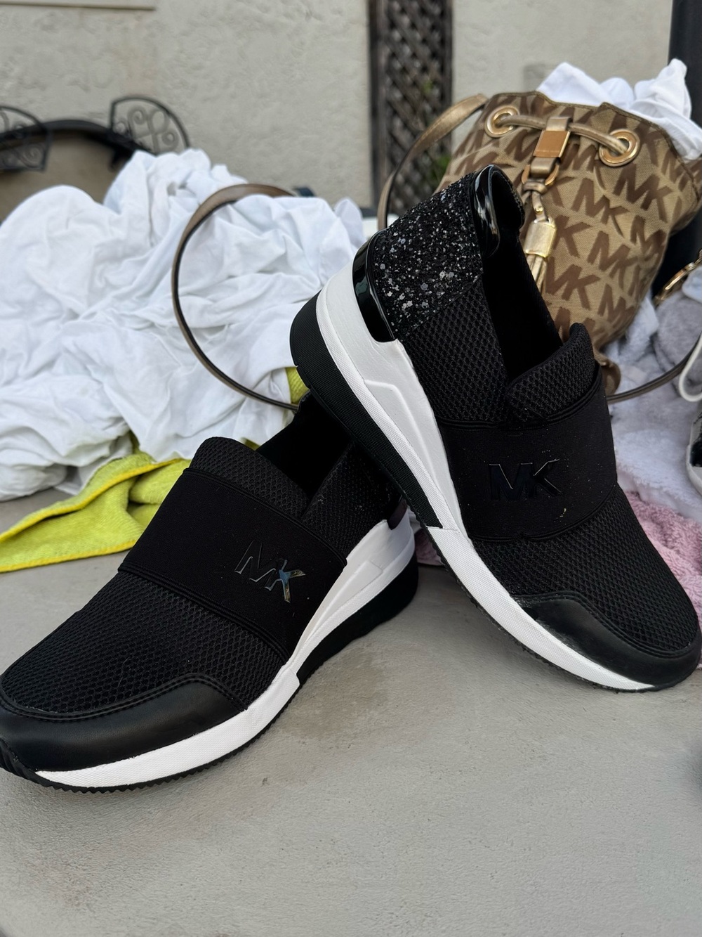 Michael Kors Black and White Slip-On MK Trainer Sneakers